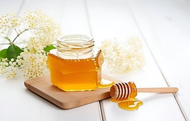 fresh honey in jar and honeycombs on white wooden table for swee