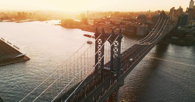 Breathtaking bird's eye view on the iconic busy Manhattan bridge in New York during epic sunrise