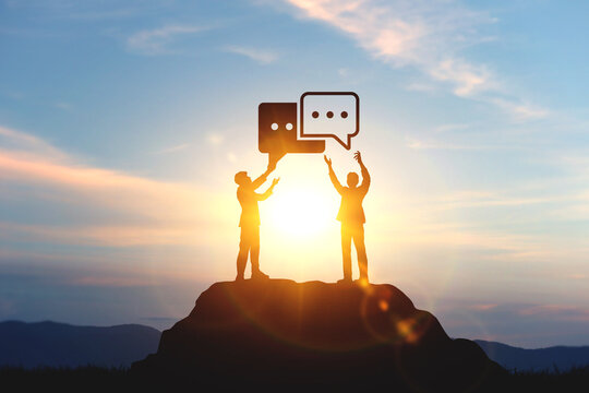 Silhouettes of two businessmen with speech bubble icons. concept of communication, customer service, and business discussion