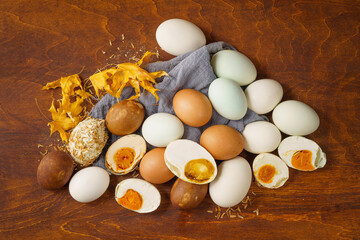 Various salted eggs on retro background