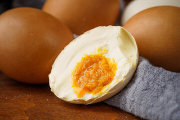 Various salted eggs on retro background