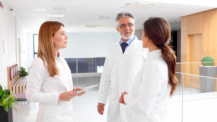 Team of scientists cooperating outside the lab