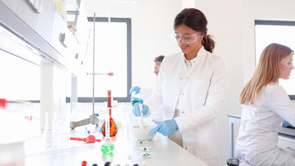 Woman working in a lab as a part of the research team