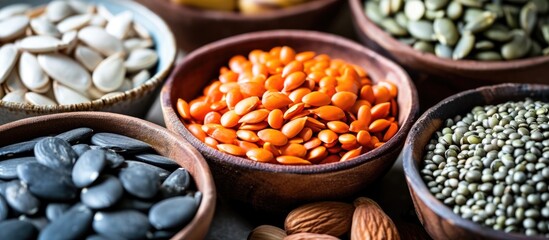 Fototapeta premium Rich in Zn, natural vegetarian foods with zinc, fiber, vitamins: pumpkin seeds, beans, almonds, pine nuts. Useful zinc sources.