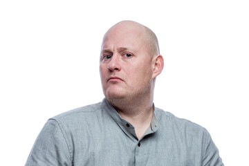 Serious bald man in a gray shirt. Isolated on a white background. Close-up.