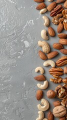 nuts and seeds meticulously arranged on a sleek gray background, with a prominent copy space banner, perfect for food-related concepts or presentations.