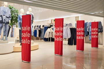 Background image of storefront with sale signs in shopping mall interior no people