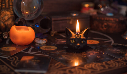 Magical scene, esoteric concept, fortune telling, tarot cards on a table	
