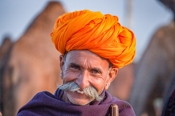 Pushkar, Rajasthan, India - November 15, 2018 Portrait of a Rajasthani Indian man dressed in...
