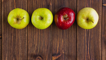 A few fresh apples on a wooden background