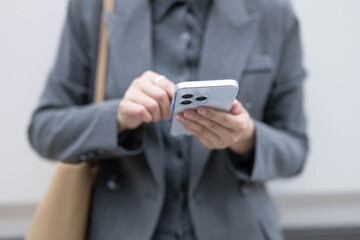 Close-up of professional woman using mobile phone