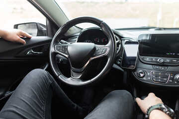 man sits in a car and rests. Rent a Car. Test Drive