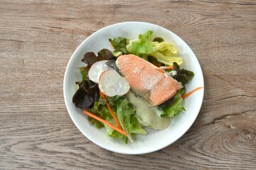 gelled salmon with mixed vegetable salad dressing spicy and sour seafood cream sauce on plate