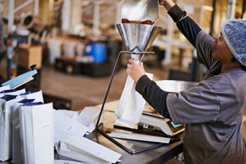 Business, worker and coffee packaging in factory with weighing tool, bags and manufacturing...