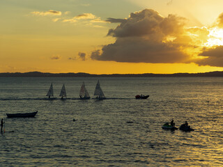 View of the dramatic sunset on Porto da Barra beach in the city of Salvador, Bahia.