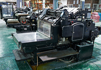 Vintage, printing and manufacturing in factory for newspaper production in business with automated...