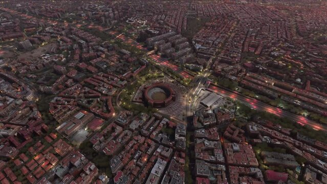 Top aerial drone view at dusk of Las Ventas Bullring in Madrid. Spain