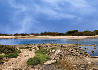 Isola dei Conigli (Rabbit Island) is a small island, known for its unspoiled beauty, located near Porto Cesareo, in Puglia, Italy, it is a protected natural area and can only be visited by boat