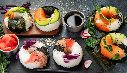Sushi donuts on a dark background. Hybrid trend food.
