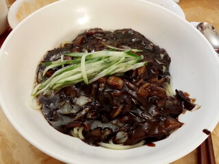 Jajangmyeon topped with cucumber slices