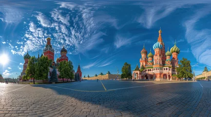 Papier Peint photo Moscou A panoramic view of the Moscow Red Square, showcasing St Basil's Cathedral and Sretenskymoskull tower, bathed in sunlight with blue sky above