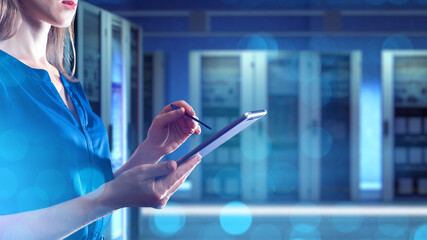 Woman system administrator. Girl in server room. Data analyst with tablet computer. Female manager serves server. Lady owner hosting company. Cropped business in data center. Woman network engineer