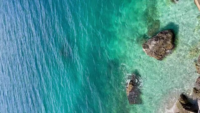 Rocky beach and crystal turquoise water of Ionian 