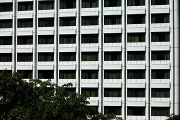 rows of symmetrical geometric windows, multi-storey buildings, arrangement of windows in...