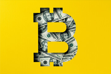 Twenty American dollar bills heap under yellow paper cutout, Bitcoin icon
