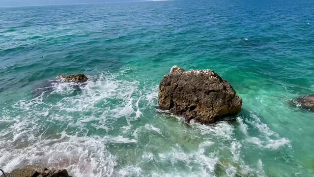 Rocky beach and crystal turquoise water of Ionian 