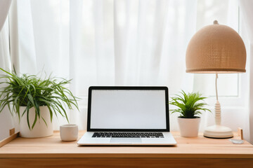 Laptop with blank screen on wooden table in living room,