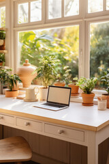 Fototapeta na wymiar Laptop on table with houseplants in pots on windowsill