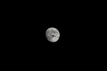 Full Moon and a Plane