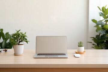 Laptop on wooden table in office. Workplace with computer and plants .