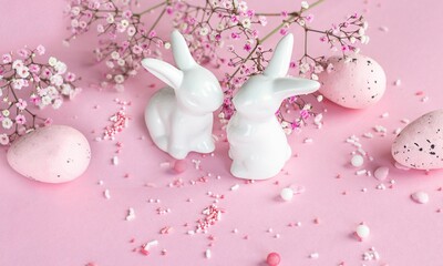 Easter background. Easter bunnies on a pink background. happy easter card. Easter. Flowers