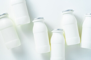drinking yogurt with probiotic in bottles on white