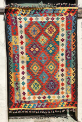 Woven multicolored wool oriental carpets with traditional Arabic ornaments