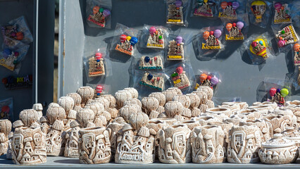 Miniature fairy chimney figurines in street shop. Mass product souvenir displayed for tourists....