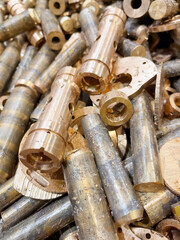 close up of bronze rods and scrap off cuts from a manufacturing process