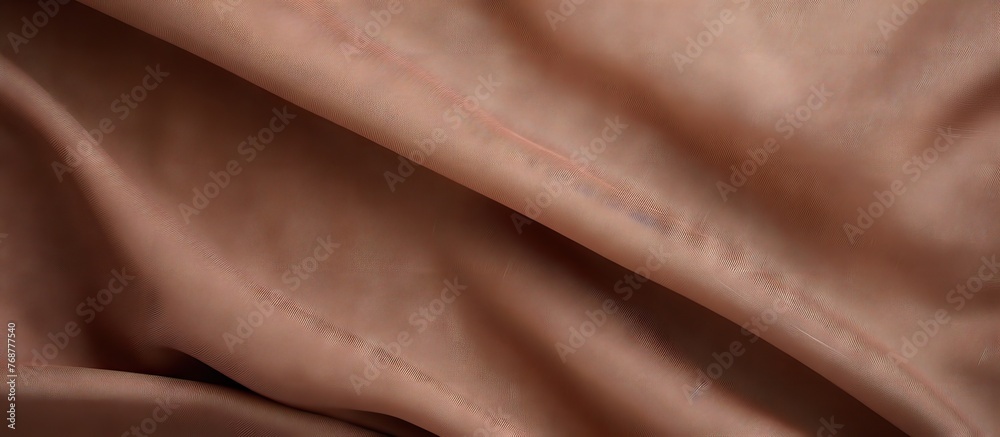 Poster close-up view of a piece of brown fabric with intricate small stitching detail, creating a textured 