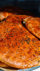 Ramadan Bakery Pide - Close-Up Shot of Traditional Delight
mmerse yourself in the savory delight of Ramadan Bakery Pide, captured in a mesmerizing close-up shot.