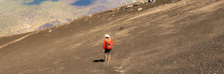 Mount Etna in Italy, Sicily. Climb Etna volcano to the top. Banner Web with copy space.