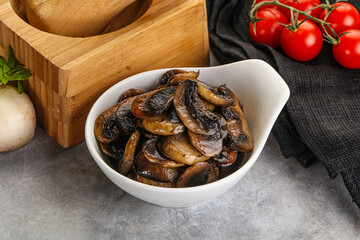 Roasted champignon mushrooms in the bowl