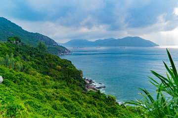 Fototapeta na wymiar A bay in the sea. Cloudy weather, clouds in the sky. Not far from Nha Trang in Vietnam.
