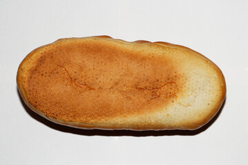 Isolated loaf of bread on white background, bottom view