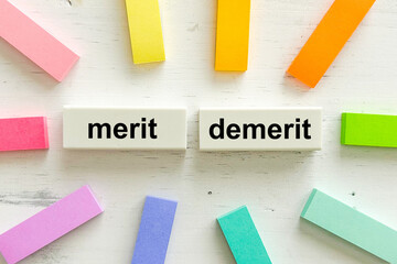 MERIT and DEMERIT word with colorful notes 