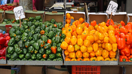 Green and Yellow Bell Peppers Vegetables at Farmers Market - Powered by Adobe