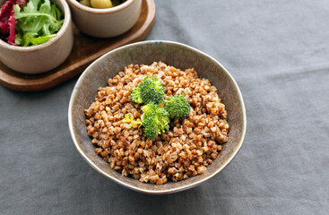 buckwheat porridge with broccoli in a bowl. gluten-free food