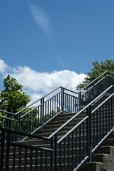 Set of concrete steps with metal railing in the park