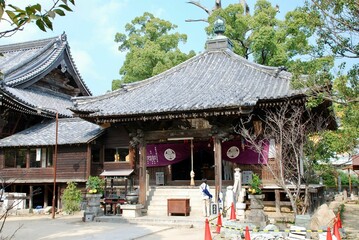 a japanese - style temple with pagoda and wood roofing